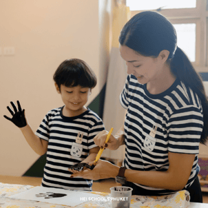 a student is having fun with color painting