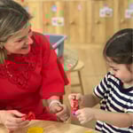 adult guides a child to play 