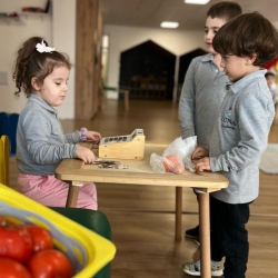 children calculate change in a business project at kindergarten