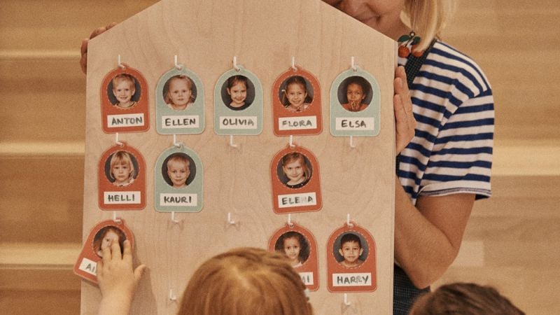 Children and teacher in real-life classroom, experiencing Positive Pedagogy
