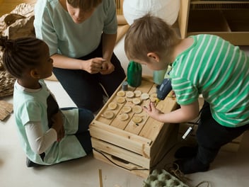 Children play in play-based learning activity