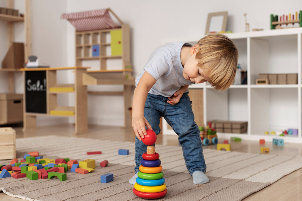 full-shot-kid-playing-floor-with-wooden-toy