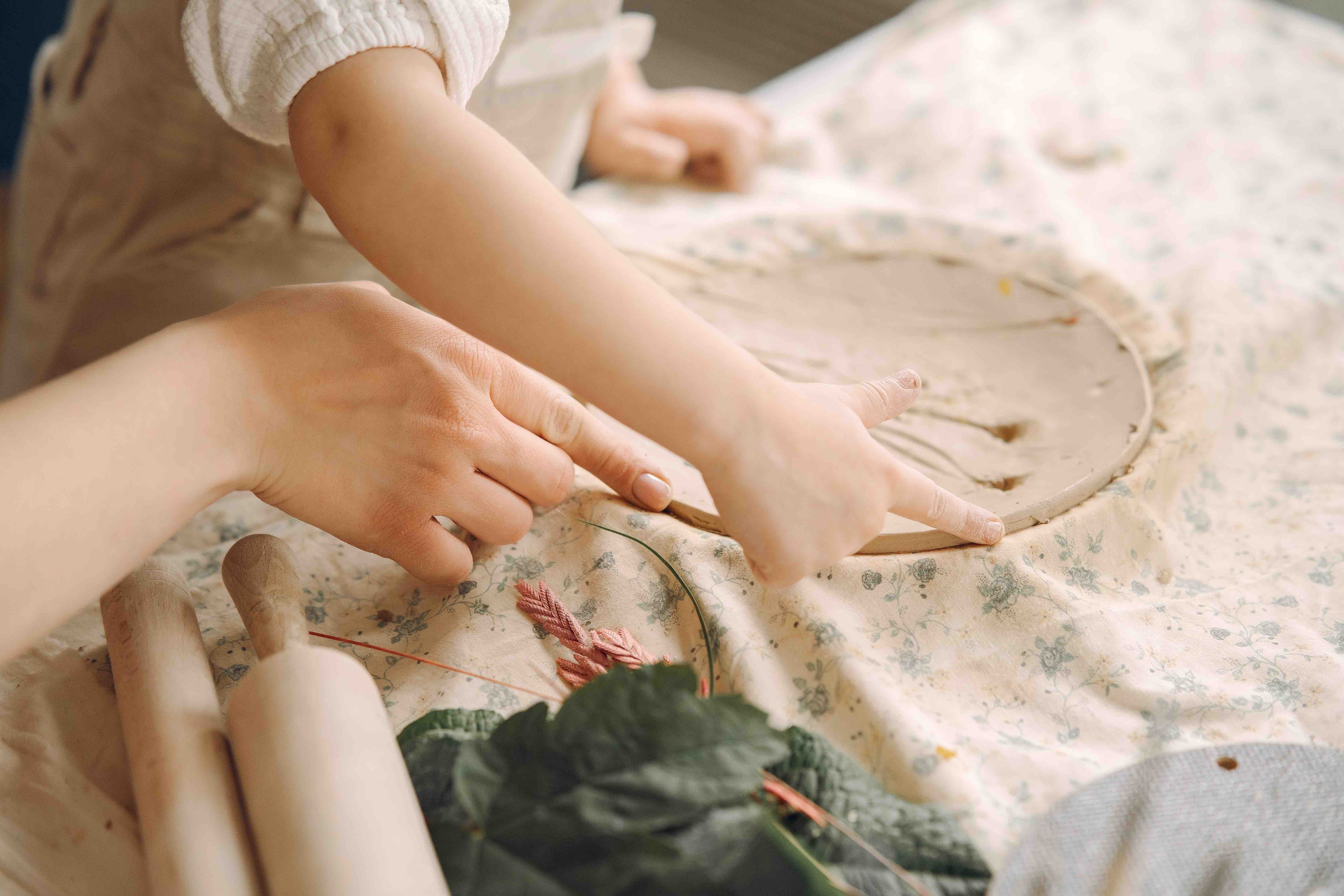 little-girl-makes-clay-plate-decorates-it-Waldorf-Education