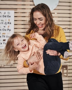 mom and daughter laughing 400x500