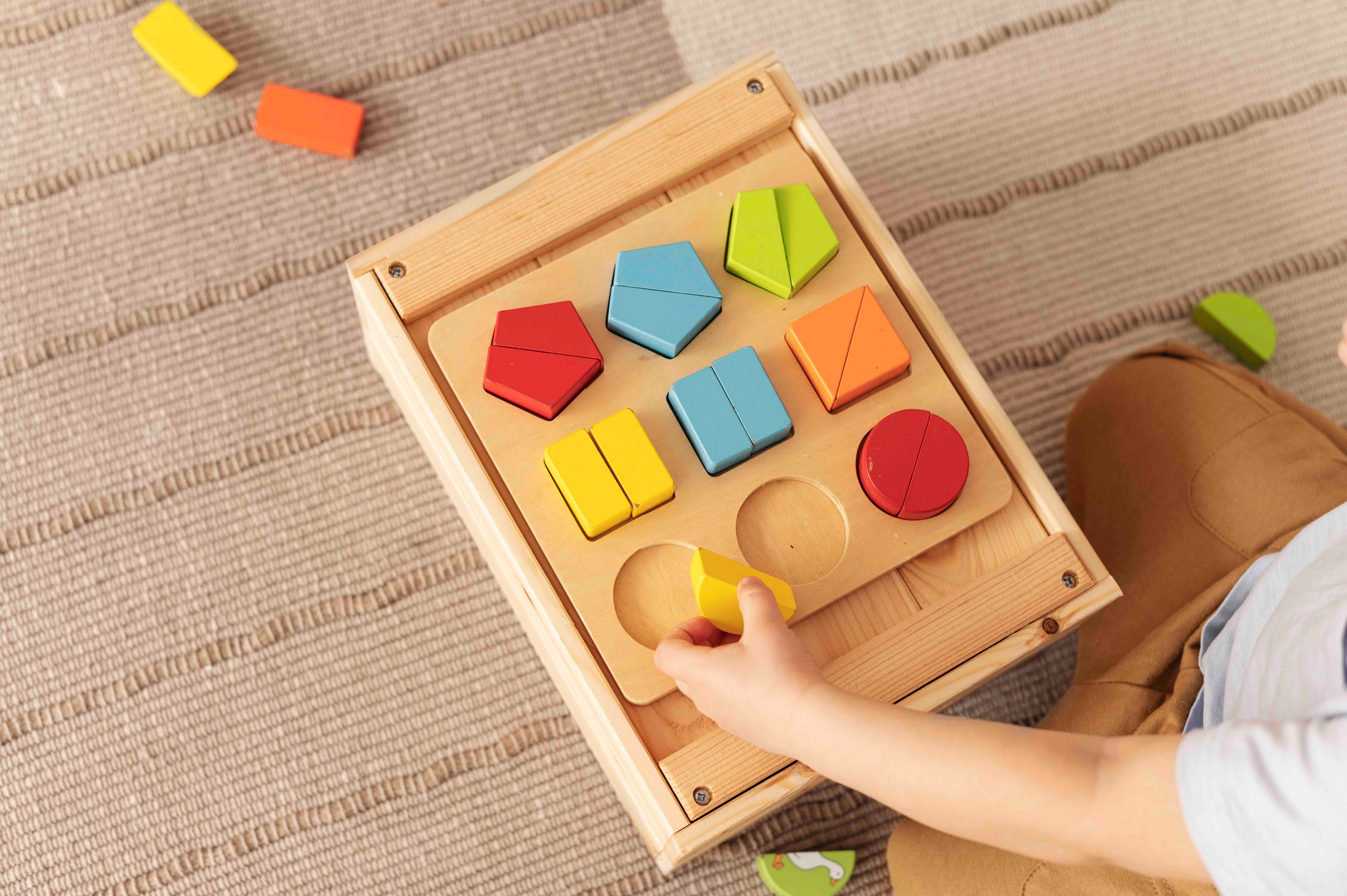 montessori kids play with wooden pieces