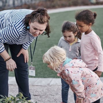 teacher and children exploring 500x500