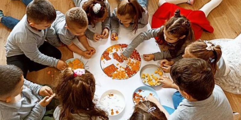 children engage in a project-based activity in kindergarten