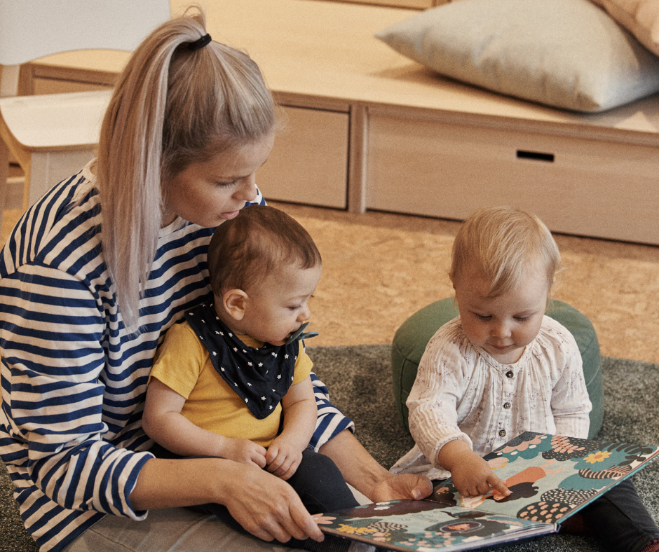 teacher with two children reading