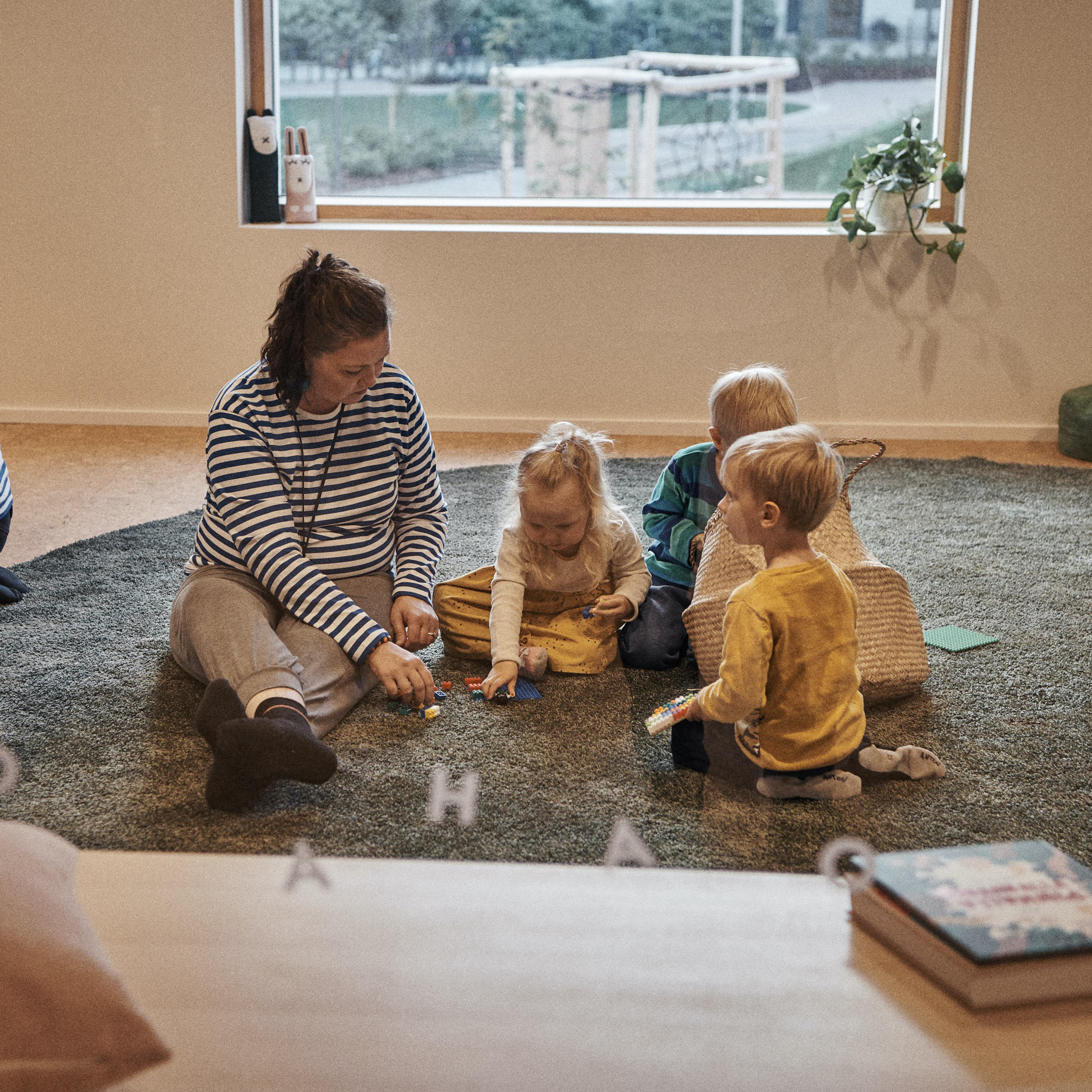 teacher playing with children