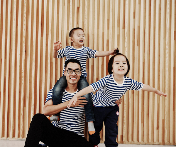 Children playing with their teacher at HEI Schools Baotou